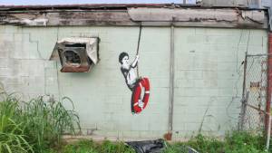 banksy - street art - graffiti - new orleans - kid on ring